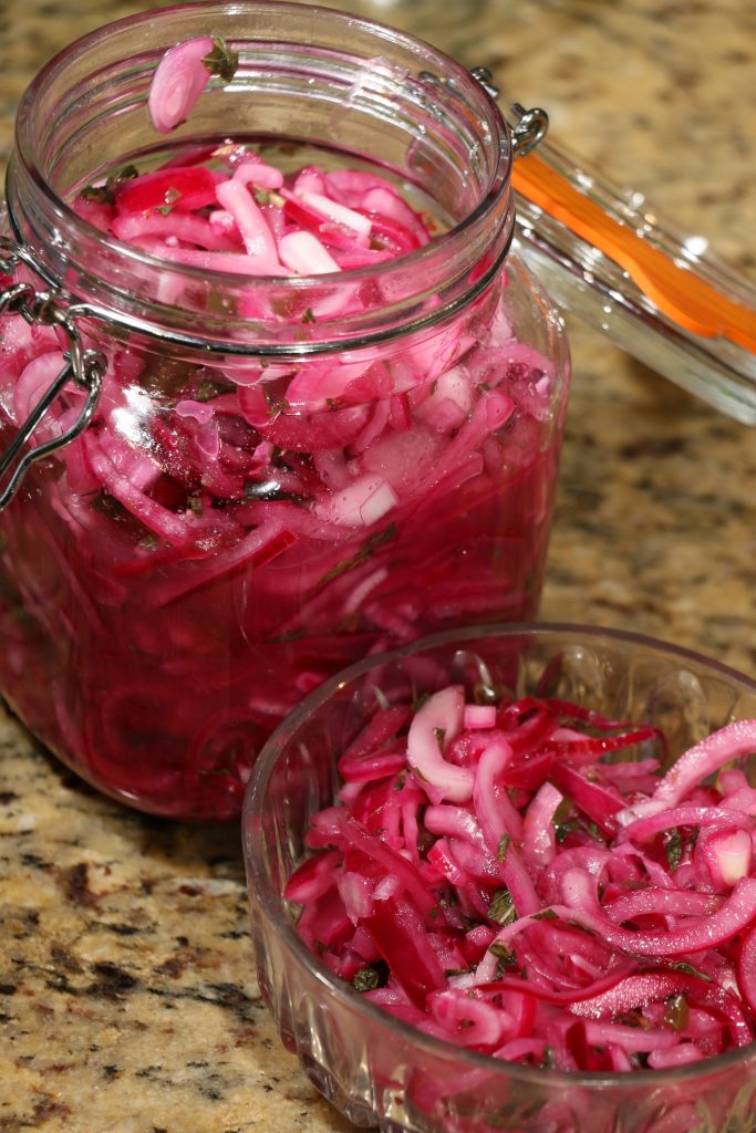 A jar of pickled red onions