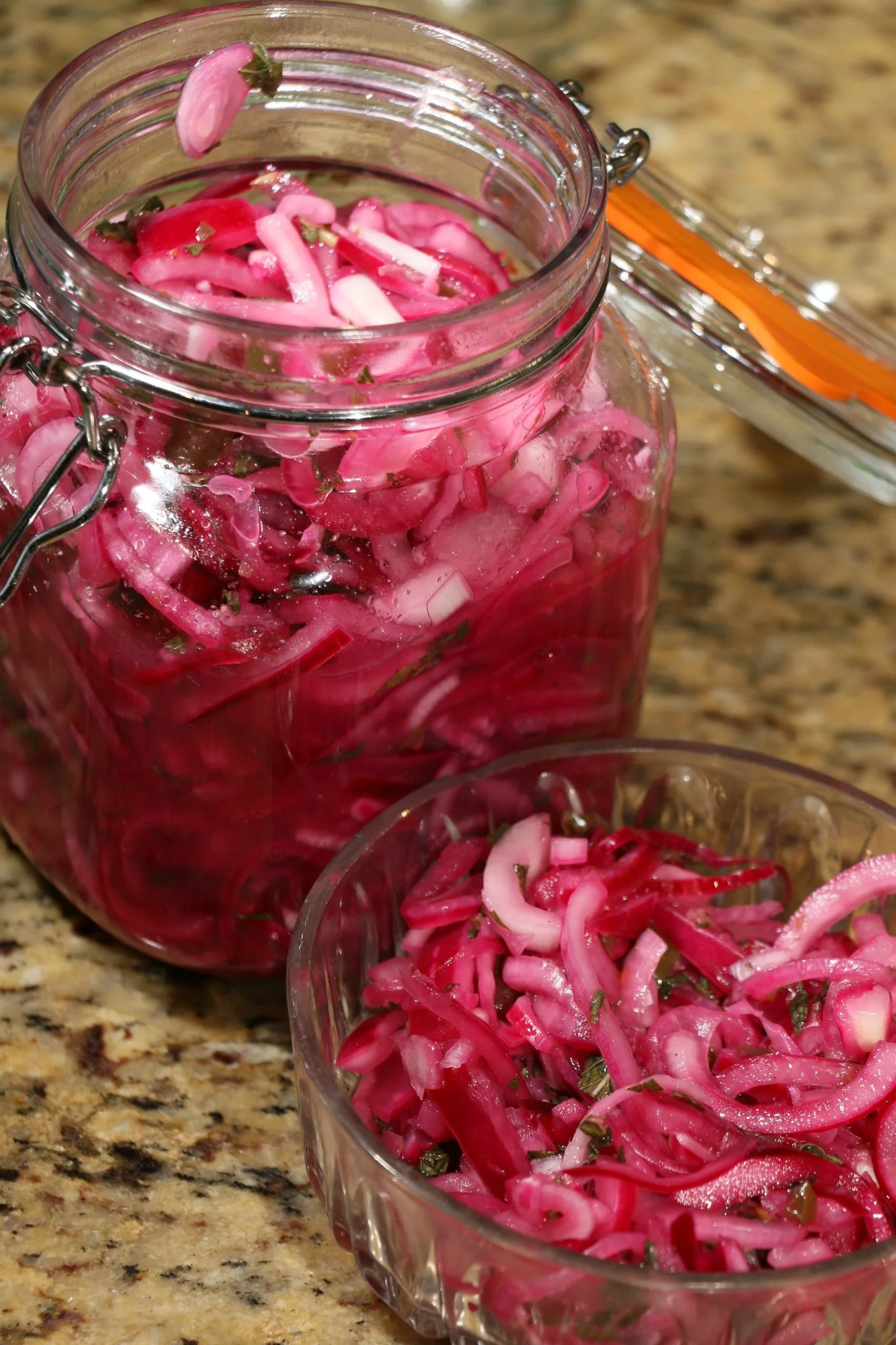 A jar of pickled red onions