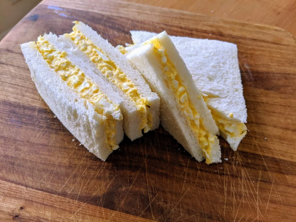 Tamago Sando on a chopping board